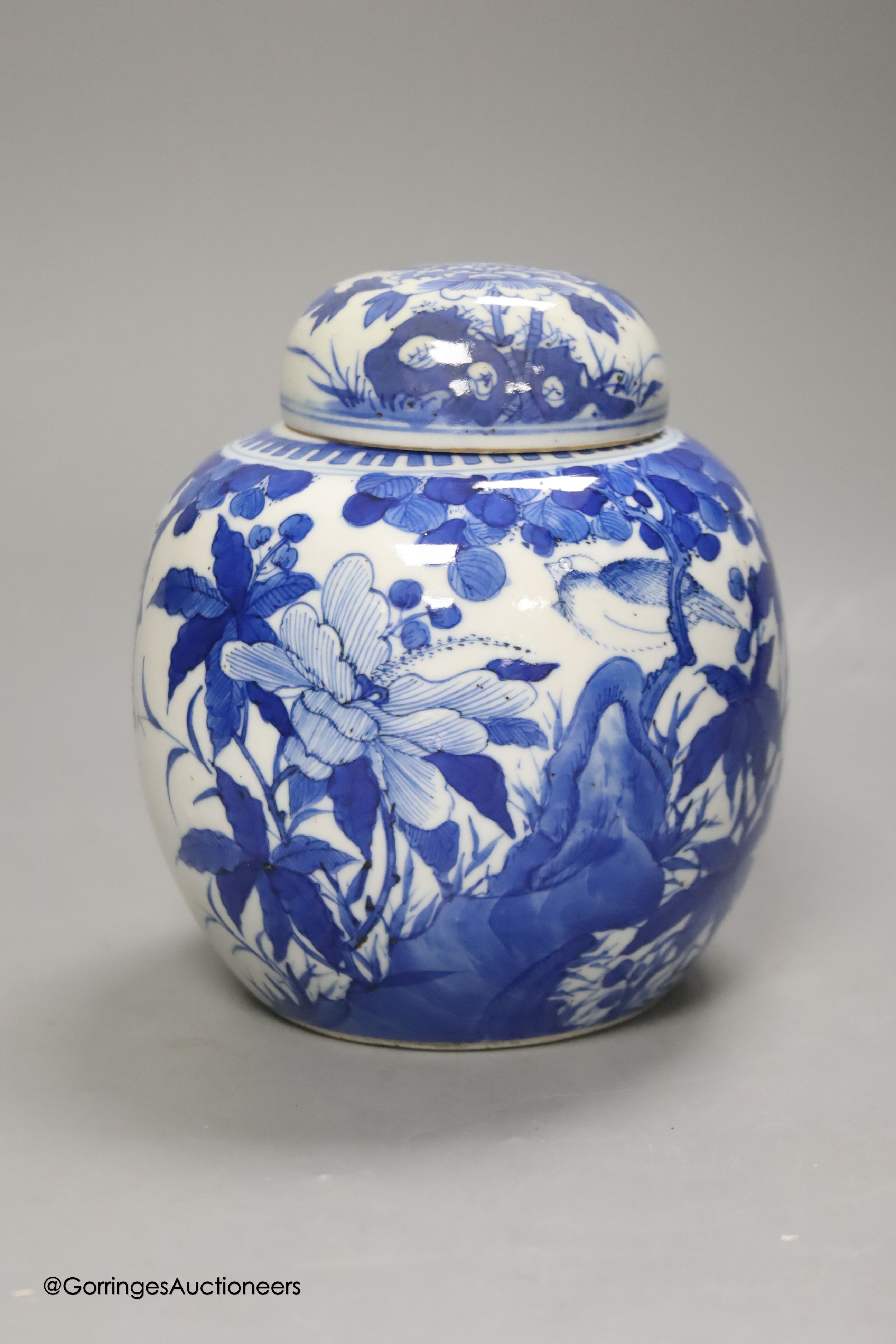 A Chinese blue and white 'birds and flowers' jar and cover, Kangxi mark, c.1900, height 15cm